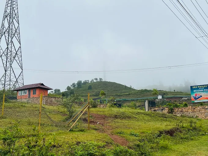 Friends enjoying a relaxing stay at Tuskers Hill Resort Anaikatti