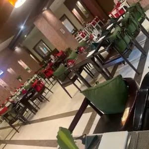 Elegant dining ambience at Melting Pot Restaurant inside Poppys Hotel Madurai