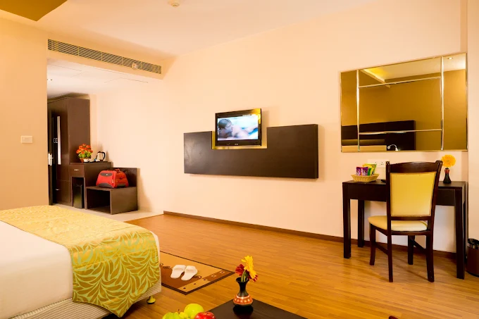 Clean and comfortable guest room at POPPYS Hotel Madurai