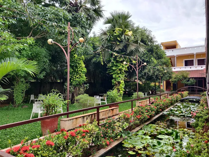 Large swimming pool at Poppys Olive de’ Villa Pondicherry during daytime