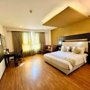 Clean and comfortable hotel room interior at Poppys Hotel Madurai
