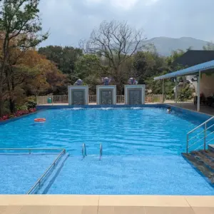 Resort pool, bonfire, and group activities at Tuskers Hill Resort Anaikatti