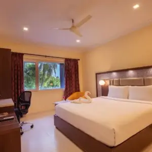 Clean hotel room near railway station at Vinayaga by Poppys Kumbakonam