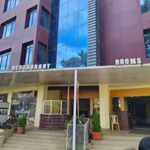 Neat and comfortable hotel room at Vinayaga Inn by Poppys Ooty