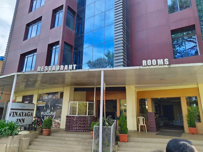 Neat and comfortable hotel room at Vinayaga Inn by Poppys Ooty